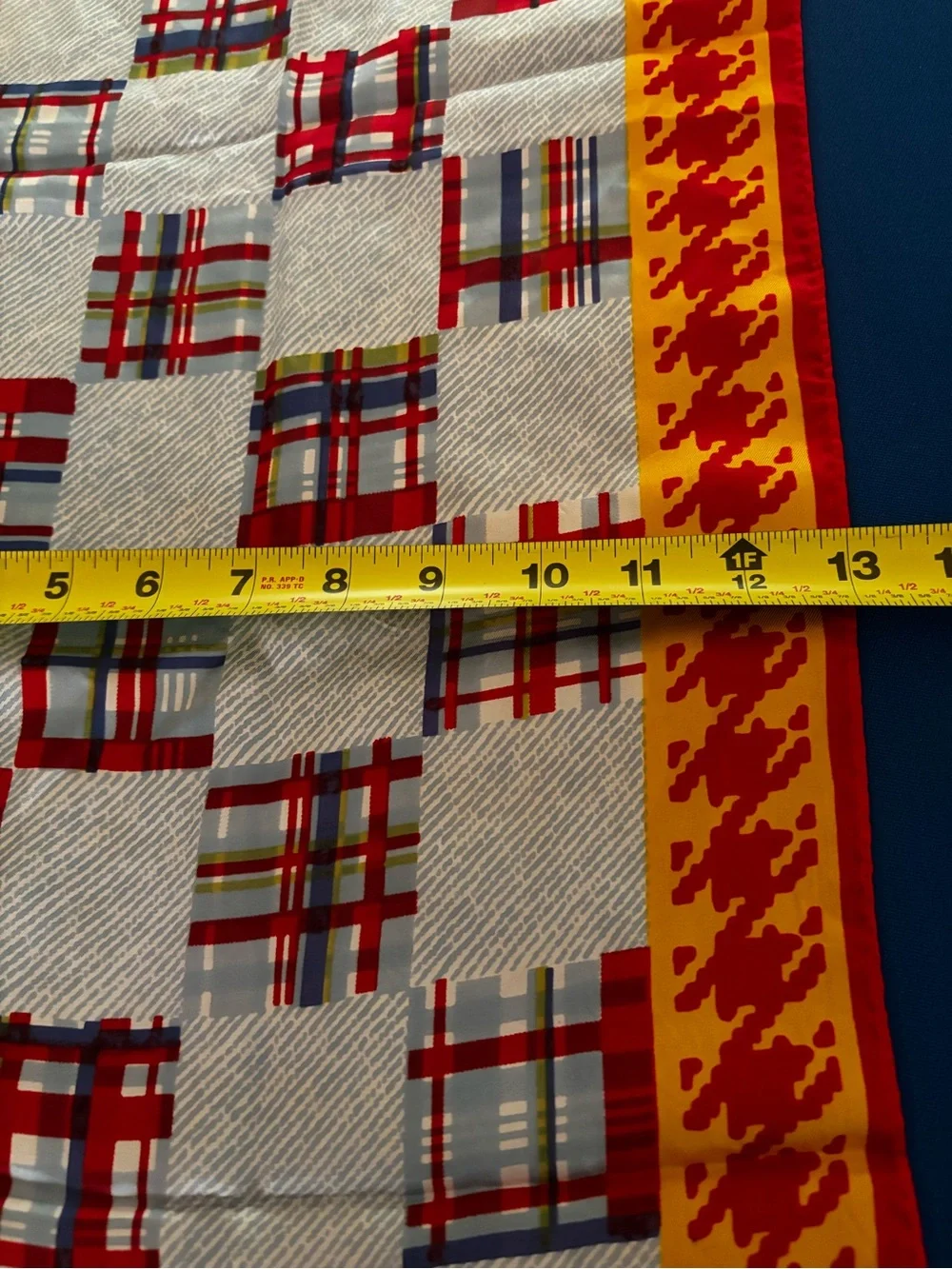 vibrant red and yellow houndstooth pattern scarf
